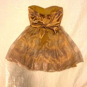 Tan color prom dress with silver sparkles